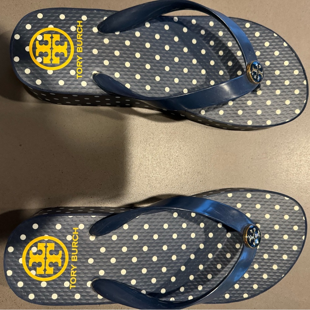 Like new navy Tory Burch flip flops.  Size 6